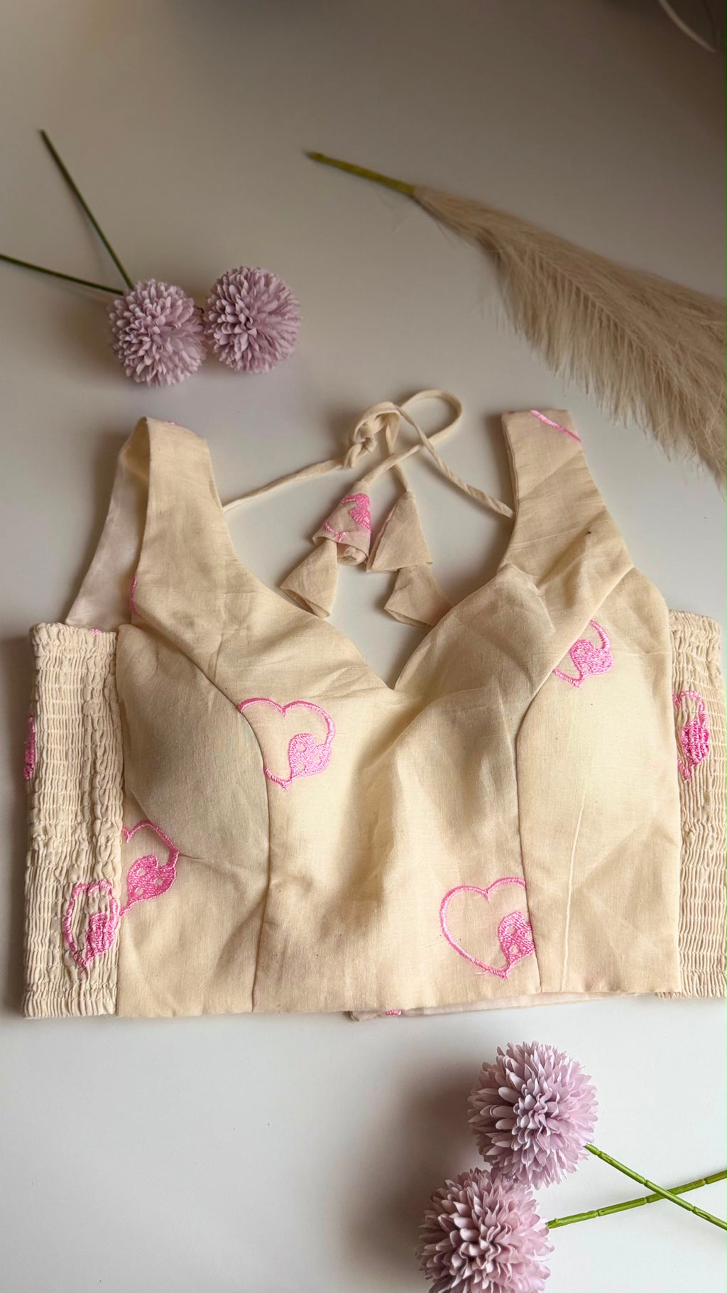 DILRUBA ivory heart-embroidered padded stretchable sleeveless blouse, front view