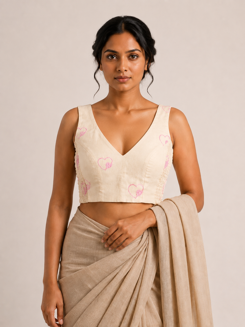 DILRUBA ivory heart-embroidered sleeveless blouse, styled model view