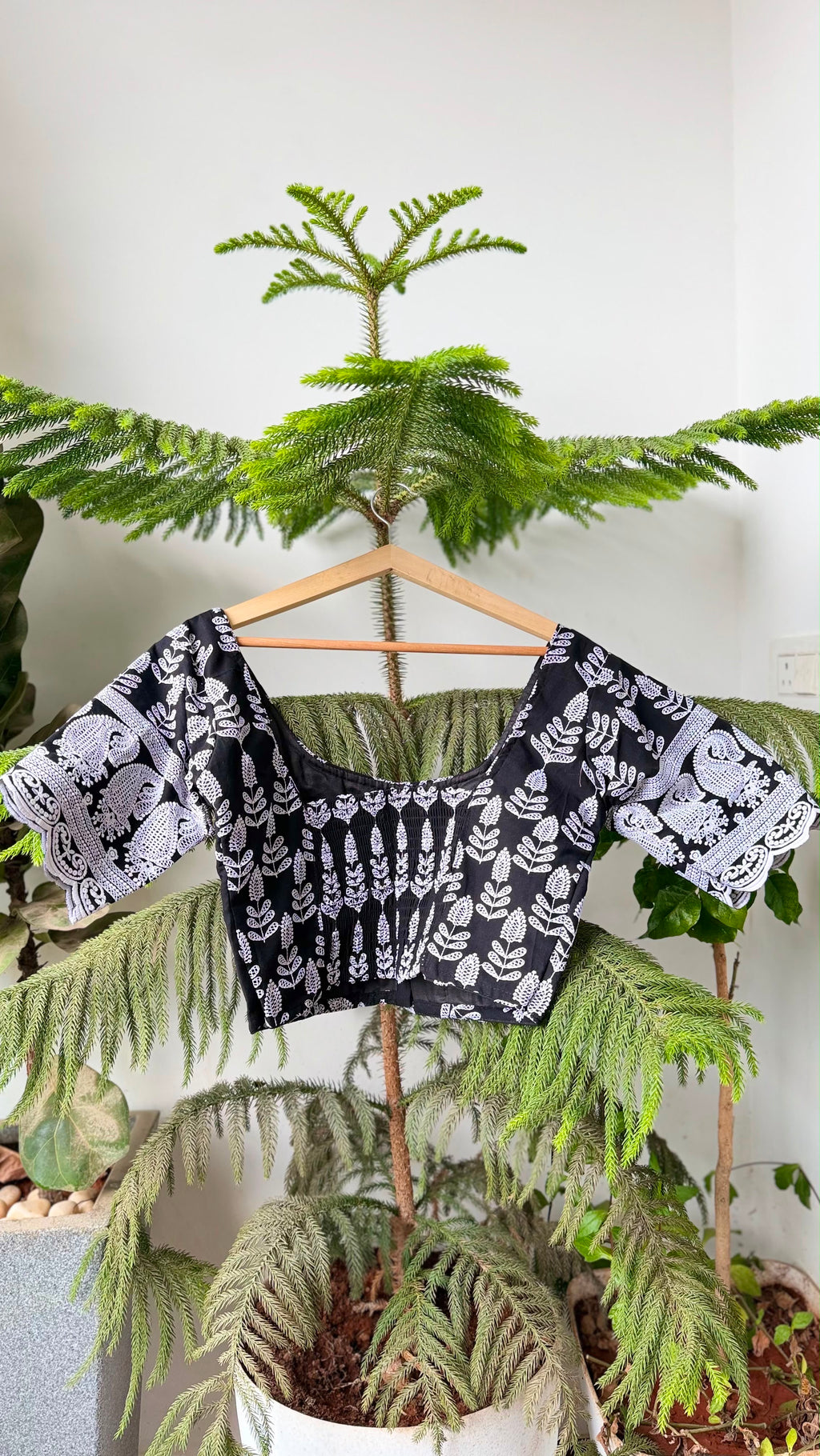 KAAJAL NOOR black chikankari blouse with contrasting white motifs, side view