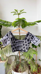 KAAJAL NOOR black chikankari blouse with contrasting white motifs, side view