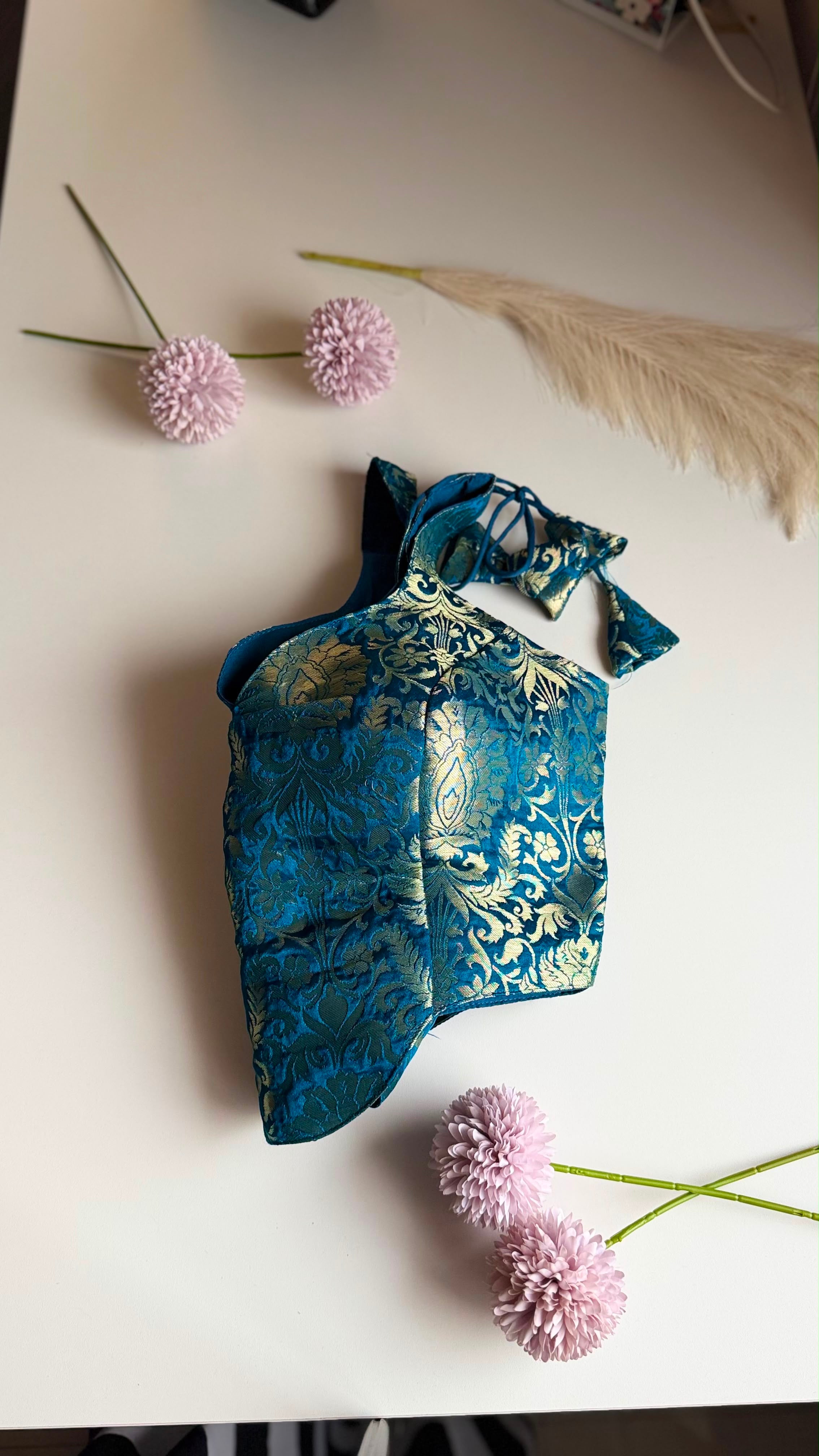 NEELIKA NAAZ peacock blue brocade blouse, curved hem detail view